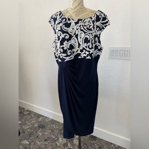 Navy pretty dress with white satin bodice embellishments. Ruched in front.